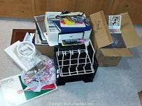 Full overview of lot including letter bins, stacked CD jewel cases, paper products and Mont Blanc pen box