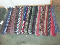 Full view of all 20 men's ties arranged side-by-side showing variety of colors and patterns