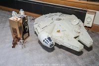 Millennium Falcon model, several vintage Star Wars figures, and the boxed Special Edition Trilogy set on floor.
