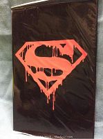 Front view of the Death of Superman sealed comic showing black cover with red dripping Superman logo.
