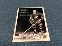 Front view of the hockey card showing Bob Baun in uniform with autograph across the lower section.