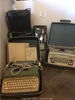 Lot including vintage manual typewriter in case, Smith Corona Coronet Electric typewriter in case, shredder box, and VCR taping kit.