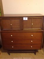 Front full view of chest showing lower drawers and upper cane-panel cabinet doors