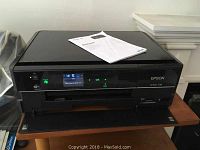 Epson Artisan 730 printer with quick guide manual on top