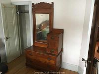 Full view of oak dresser with swing mirror and side cubby storage