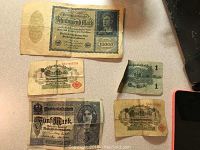 Five German banknotes from early 1900s period, denominations include 10,000 Mark, 5 Mark, 1 Mark, various condition with folds and wear