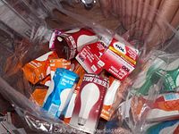 Multiple packages of new incandescent bulbs in plastic packaging