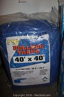 Blue polyethylene tarp in original packaging showing Bulldog Tarps branding and size 40x40 ft.