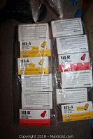 Multiple boxes of Blackburn fixed spring wire connectors in red, yellow, orange, and blue. Each box labeled with model number and color. Packaging shows installation instructions.