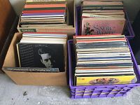 Four containers of vinyl LP records with visible sleeves for Hello Dolly and Snow White and the Seven Dwarfs