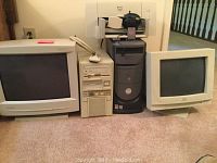 View of entire lot showing 2 monitors, 2 desktop towers, and printer stacked on top