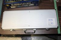 Closed aluminum carrying case for poker set.