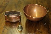 Copper bowl, copper pot, and brass bell on wooden surface, photo showing all items in the lot together