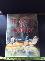 Front cover of the book showing title and canoe illustration