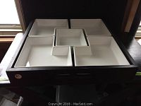 Image showing black wooden tray containing five white ceramic dishes arranged to fit within separate compartments.