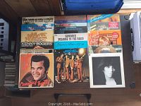Top view of a selection of LP record covers including Kenny Rogers, Conway Twitty, and various country collections.