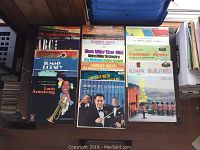 Photo of vinyl records laid out, showing various artists' album covers.