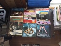 Photo showing a selection of LP record album covers including artists Gordon Lightfoot, The Nutcracker, Olivia Newton-John, and The Cracker album
