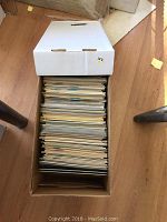 Top view of the box packed with approximately 150 comic books