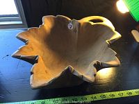 Maple leaf shaped wooden fruit bowl carved from solid butternut, showing interior and overall shape with natural wood grain.