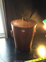 Front and top view showing teak veneer ice bucket with lid and brass handle.
