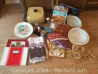 Full view of the assortment showing all items included in the lot on the floor