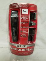 Front view of Wahl Groomsman kit in original packaging showing trimmer and attachments arranged neatly with branding and features visible