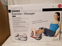 Box front showing Evertone Swing Energy Arms & Legs Exerciser/Massager with image of device and woman using it on legs, highlighting model BK1050 and product features.