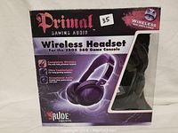 Front view of Primal Wireless Headset box showing headset inside with branding and features