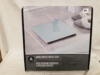 Box of the Hometrends Magic Display Digital Scale showing product image and branding.