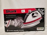 Photo showing Shark Professional Steam Iron box with iron pictured emitting steam and branding indicating powerful steam burst.