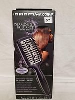 Front box view showing brand, product name, and image of the straightening brush.