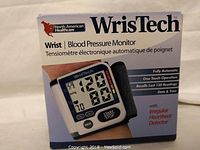Box of the WrisTech wrist blood pressure monitor showing product image and features