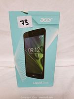 Photo showing the original teal Acer Liquid Zest phone box with an image of the phone on the front and model name Liquid Zest.