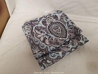 Folded fabric Hometrends Persia shower curtain showing pattern and colors clearly.