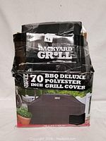 View of front of packaging showing Backyard Grill branding and product details including size and material.