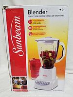 Sunbeam blender box showing brand and image of blender with filled jar and drink.