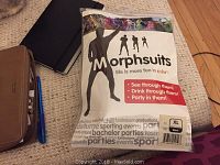 Photo of the packaged Morph suit showing branding and suit silhouette.