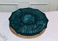 Top-down view showing all 5 pieces assembled on the wooden lazy Susan base with central bowl and 3 outer curved dishes forming a circle.