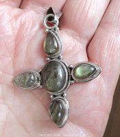 Front of the vintage sterling silver pendant cross showing five labradorite bezel set stones.