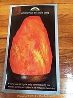 Packaging box featuring image and description of Himalayan Ionic Crystal Salt Table Lamp
