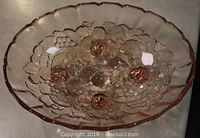 Top view of the bowl showing the detailed raised embossed fruit Garland pattern on the interior.