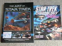Two hardcover books including 'The Art of Star Trek' and 'Star Trek Chronology: The History of the Future' placed side by side on carpet.