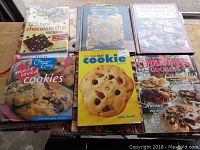 Cookbook selection focused on cookie recipes including best chocolate chip, cookie book, Christmas cookie swap, most loved cookies, 250 best cookie recipes, and Christmas cookies old and new.