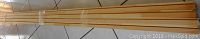 8 pieces of long finger joint pine molding bundled together, wood color natural, dimensions 5/8" x 2 3/4"