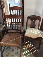 Three vintage chairs grouped together: two with rush seats and one antique side chair with cream upholstery.