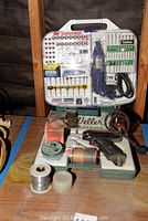 Full view of new rotary tool kit and Weller soldering kit with accessories on wooden surface