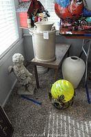 Full view of lot including angel statue, large vase, garden globe, small bench, and another ceramic vase