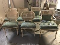 Wide shot of all six chairs arranged in two rows showing frames and upholstery