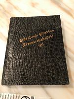 Closed black faux leather album with gold embossed 'Nürnberger-Fürther Strassenbahngeld 1921' cover